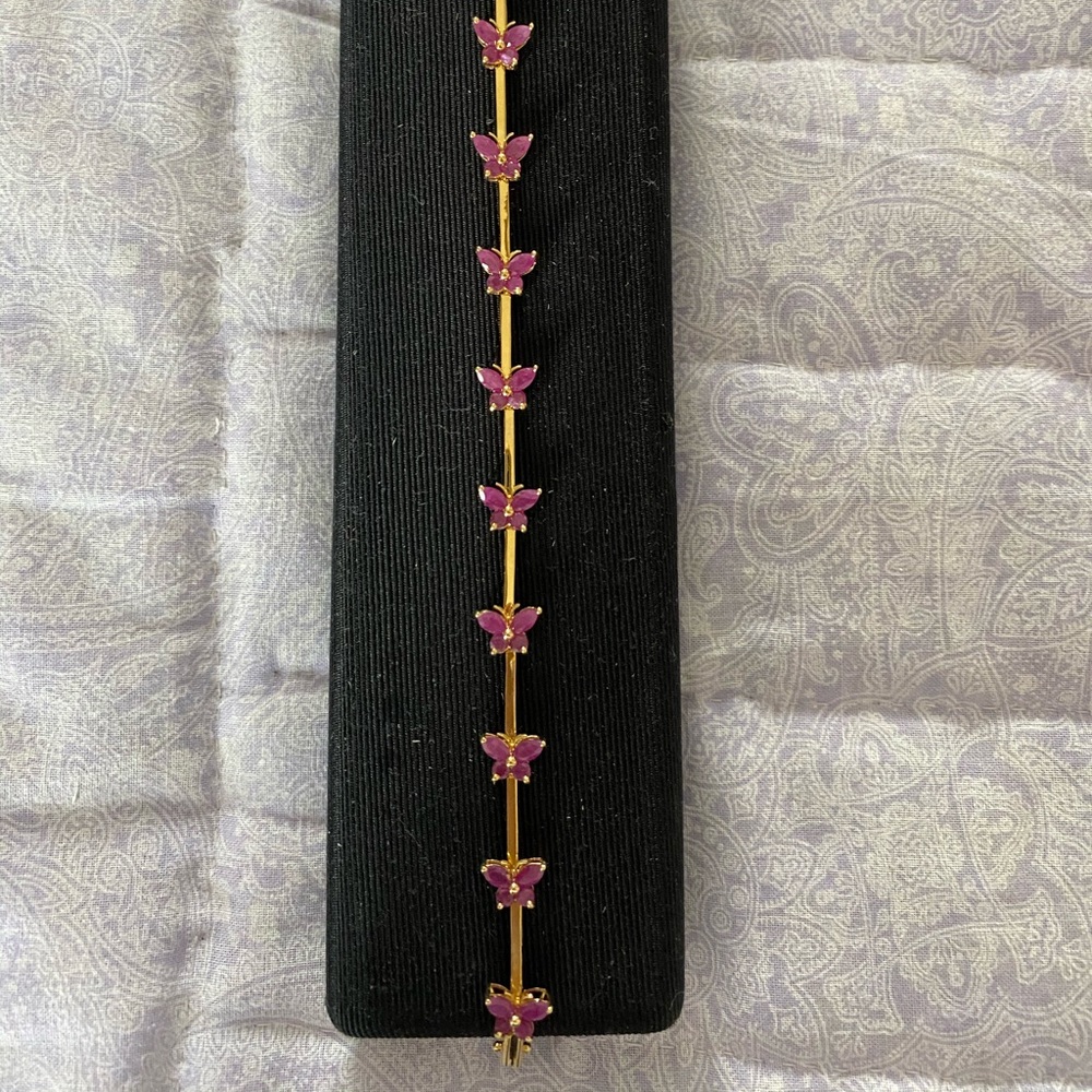 14k yellow gold and ruby bracelet.